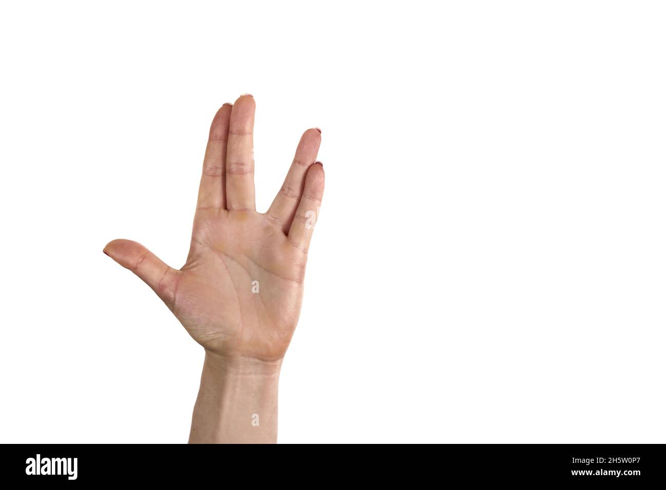 Eine Mann Hand, die den vulkanischen Gruß auf weißem Hintergrund tut. Vulkanische Hand grüßen dagegen. Spock Hand. Alpha. Stockfoto