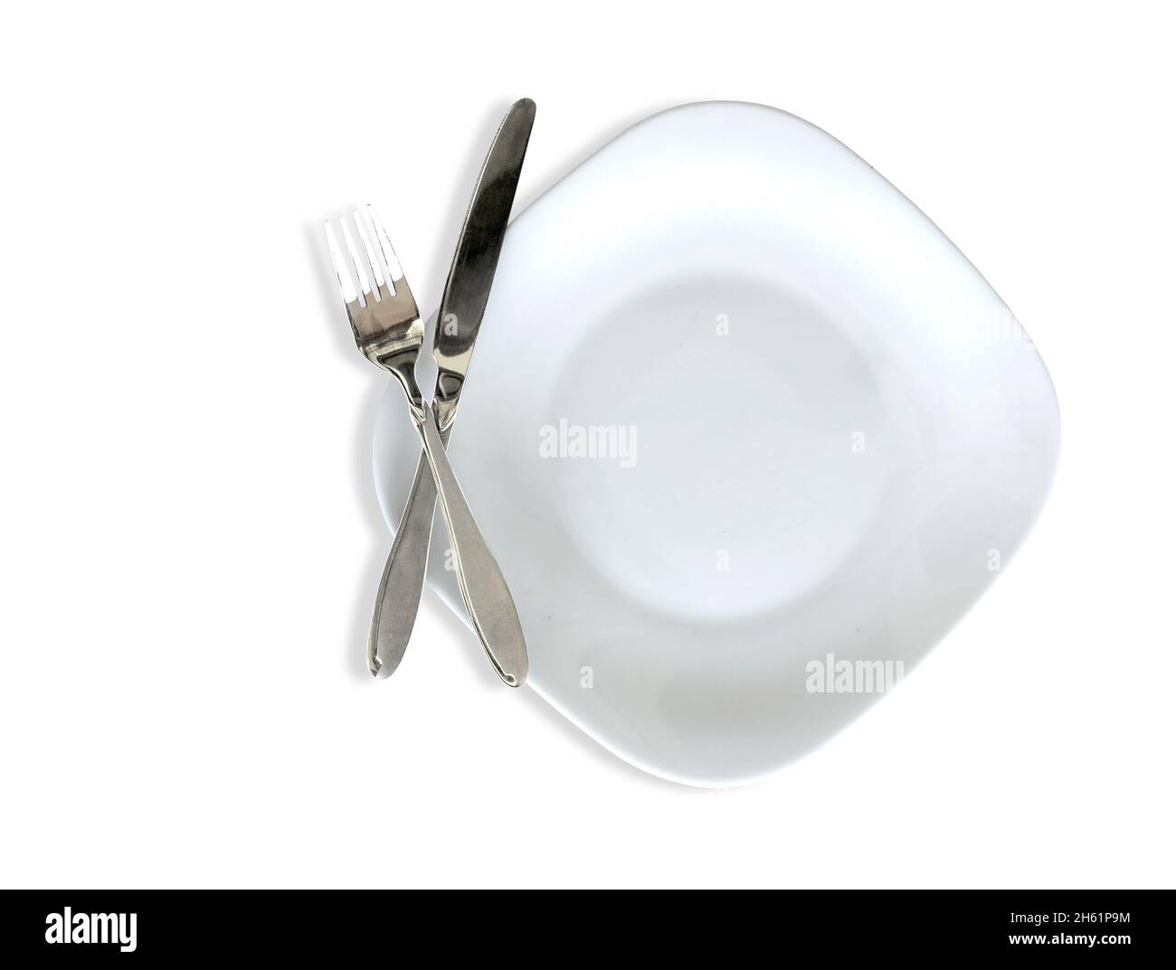 Isolierte Aufnahme von weißem quadratischen Teller mit Besteck auf weißem Hintergrund Stockfoto