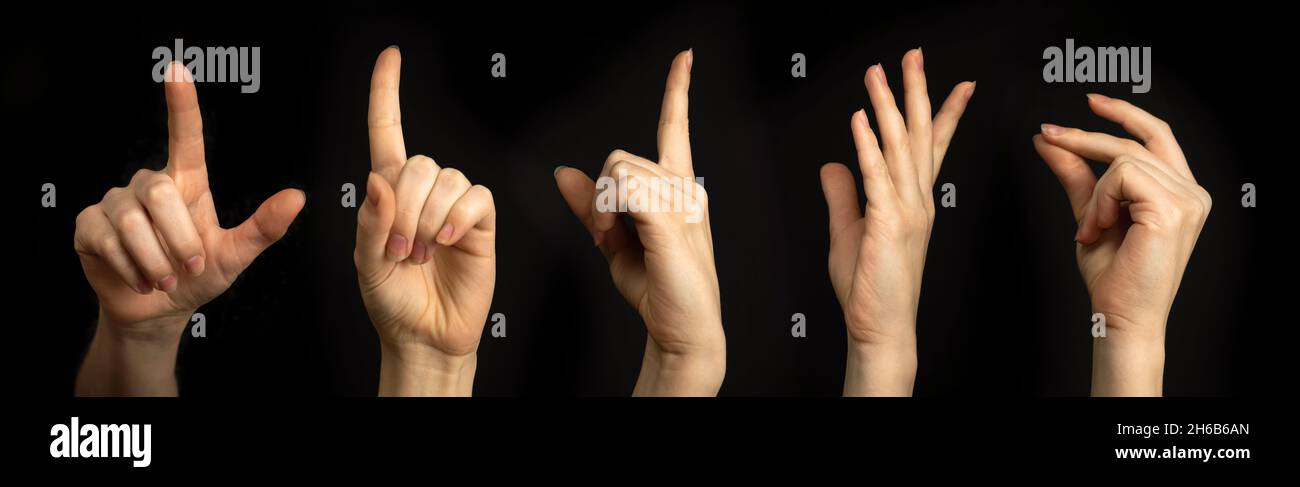 Handgesten auf schwarzem Hintergrund. Frauenhand, Geschäftsschilder, Banner Stockfoto