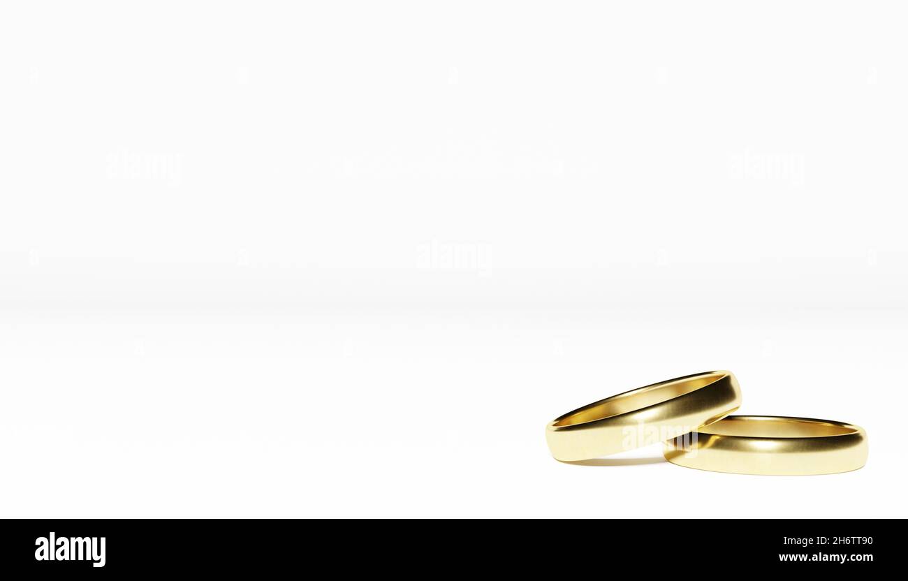 Goldene Hochzeit Ringe auf weißem Hintergrund Stockfoto