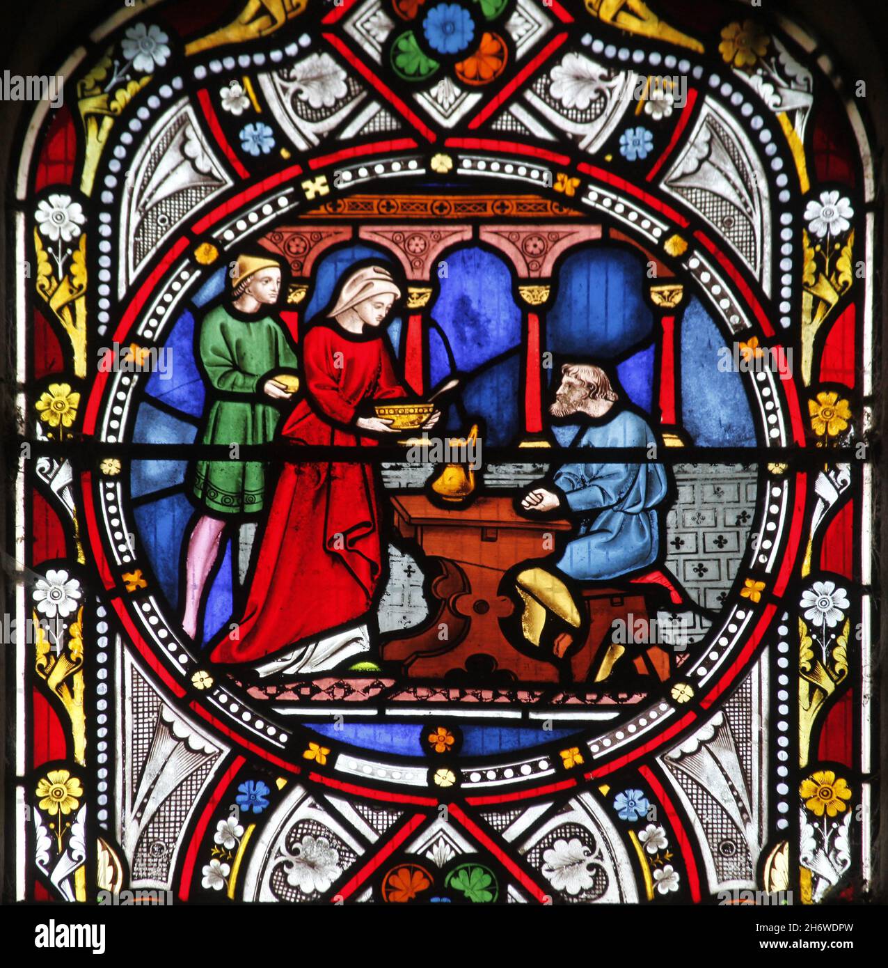 Ein Buntglasfenster von Clayton & Bell 1858 mit Werken der Barmherzigkeit (Feed the Hungry), Holy Trinity Church, Blatherwycke , Northamptonshire Stockfoto