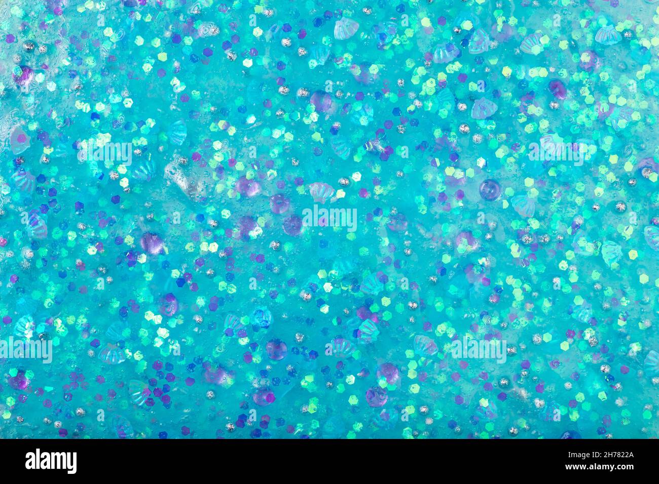 Blauer abstrakter Strukturschleim mit Glitzer und Streuseln Stockfoto