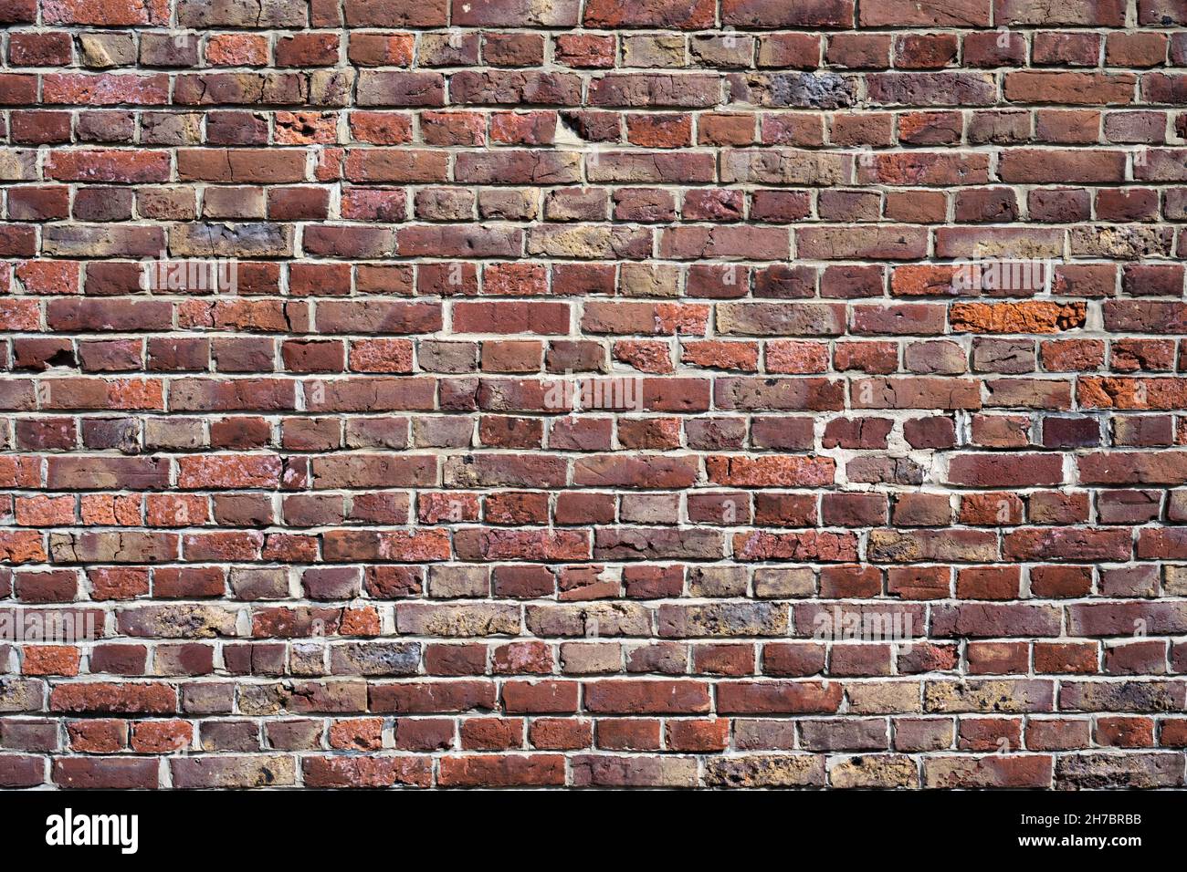 Hohe Detailstruktur / Hintergrund der alten verwitterten Ziegelwand Stockfoto