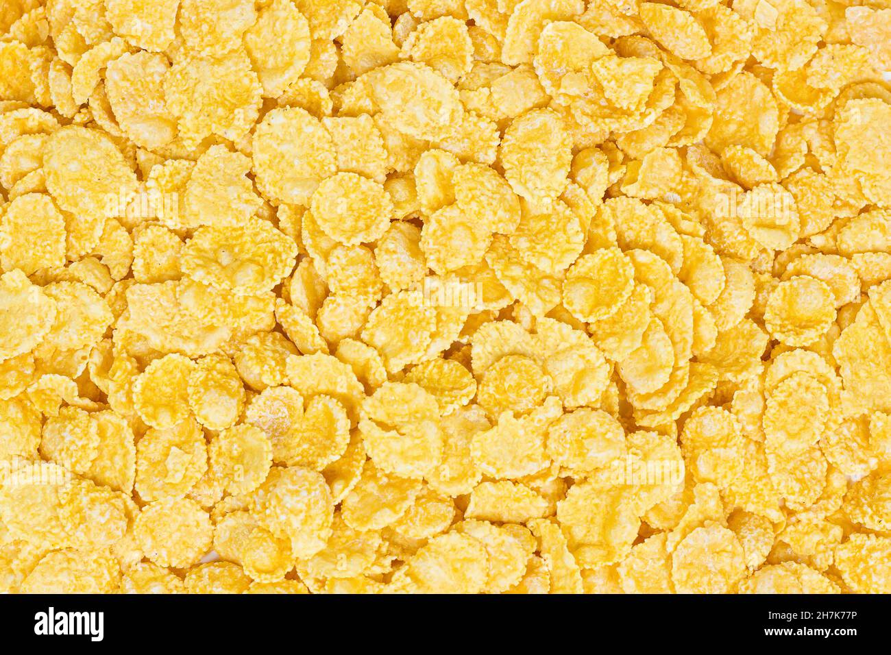Goldgelb knusprige Cornflakes Getreidestruktur als Hintergrund für Lebensmittel. Stockfoto