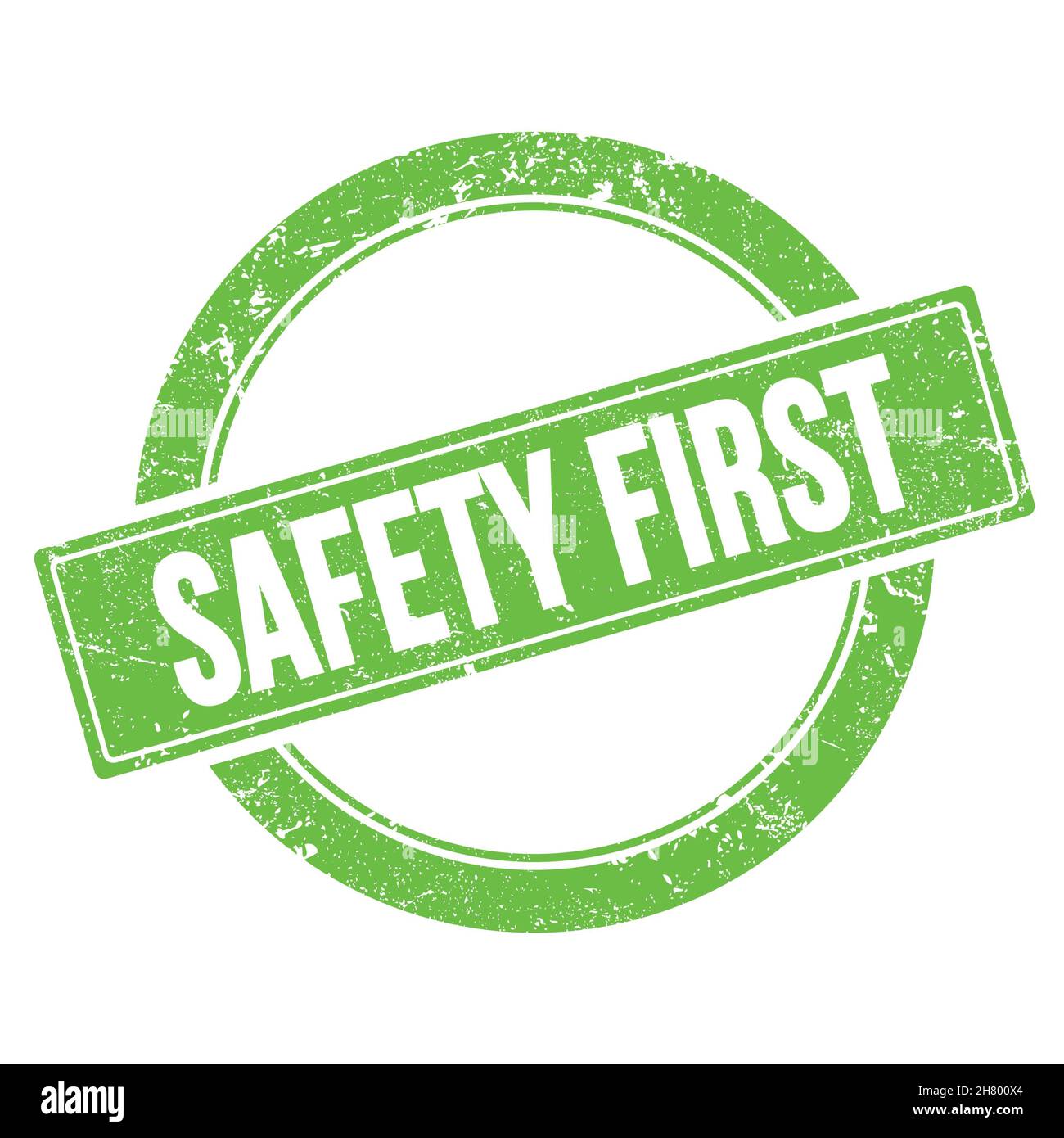 SICHERHEIT ERSTER Text auf grünem grungy runden Vintage Stempel. Stockfoto