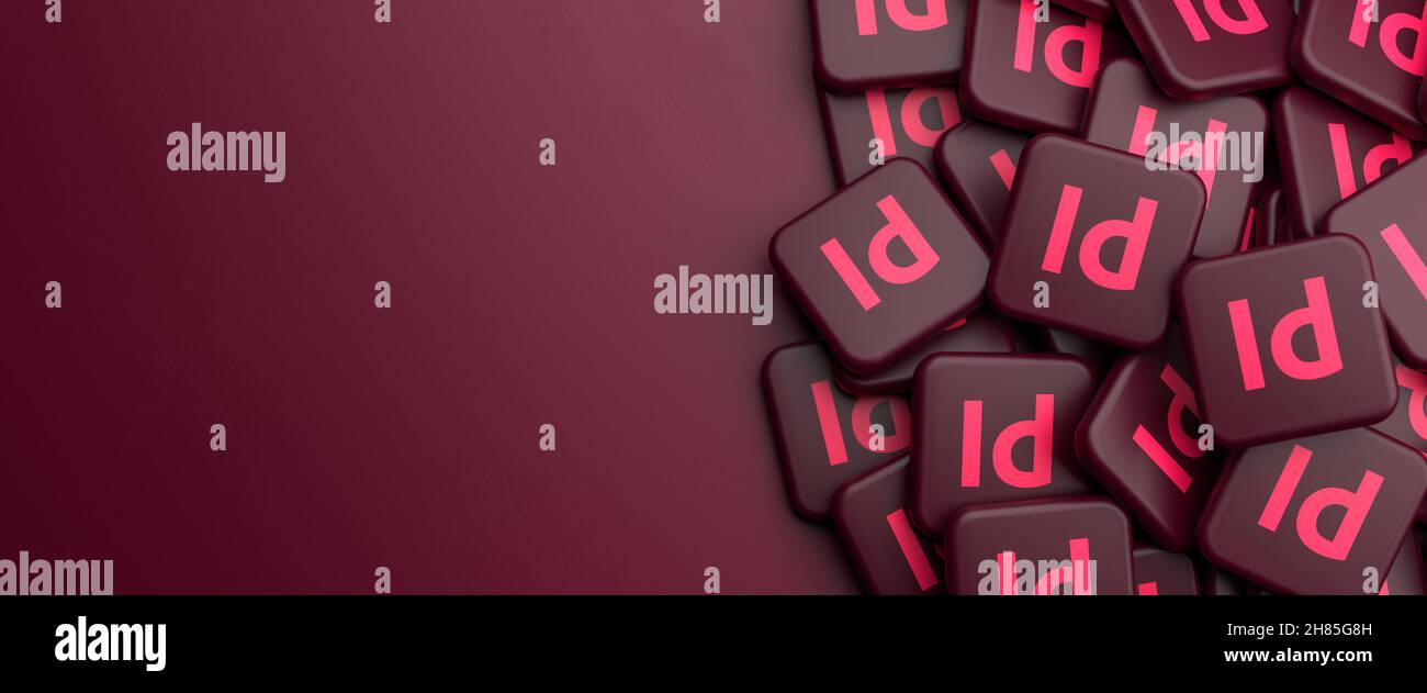 Logos der Desktop-Publishing-Software Adobe InDesign sind ein wichtiger Teil der Creative Cloud Apps Suite auf einem Haufen auf einem Tisch. Speicherplatz kopieren. Webbann Stockfoto