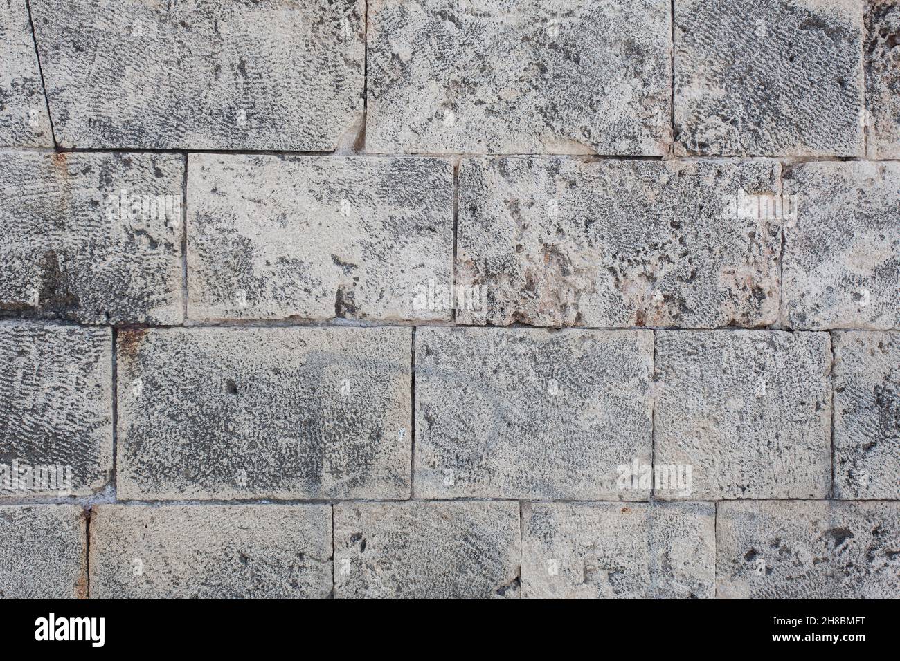 Detail einer alten Steinmauer am Hafen Stockfoto