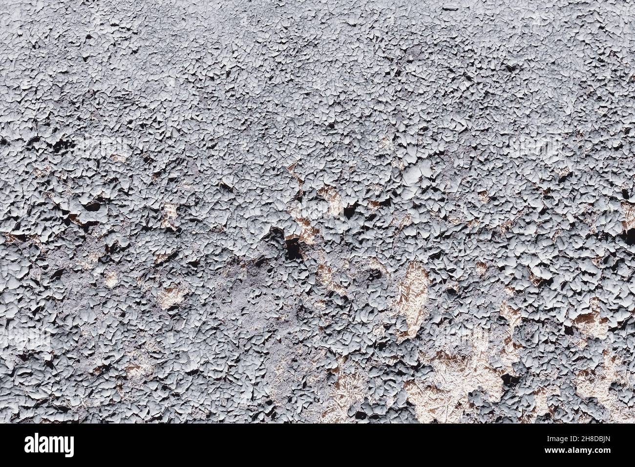 Grunziger Hintergrund. Gesprungene Farbstruktur. Abblätternde Farbe, grunge Textur. Stockfoto