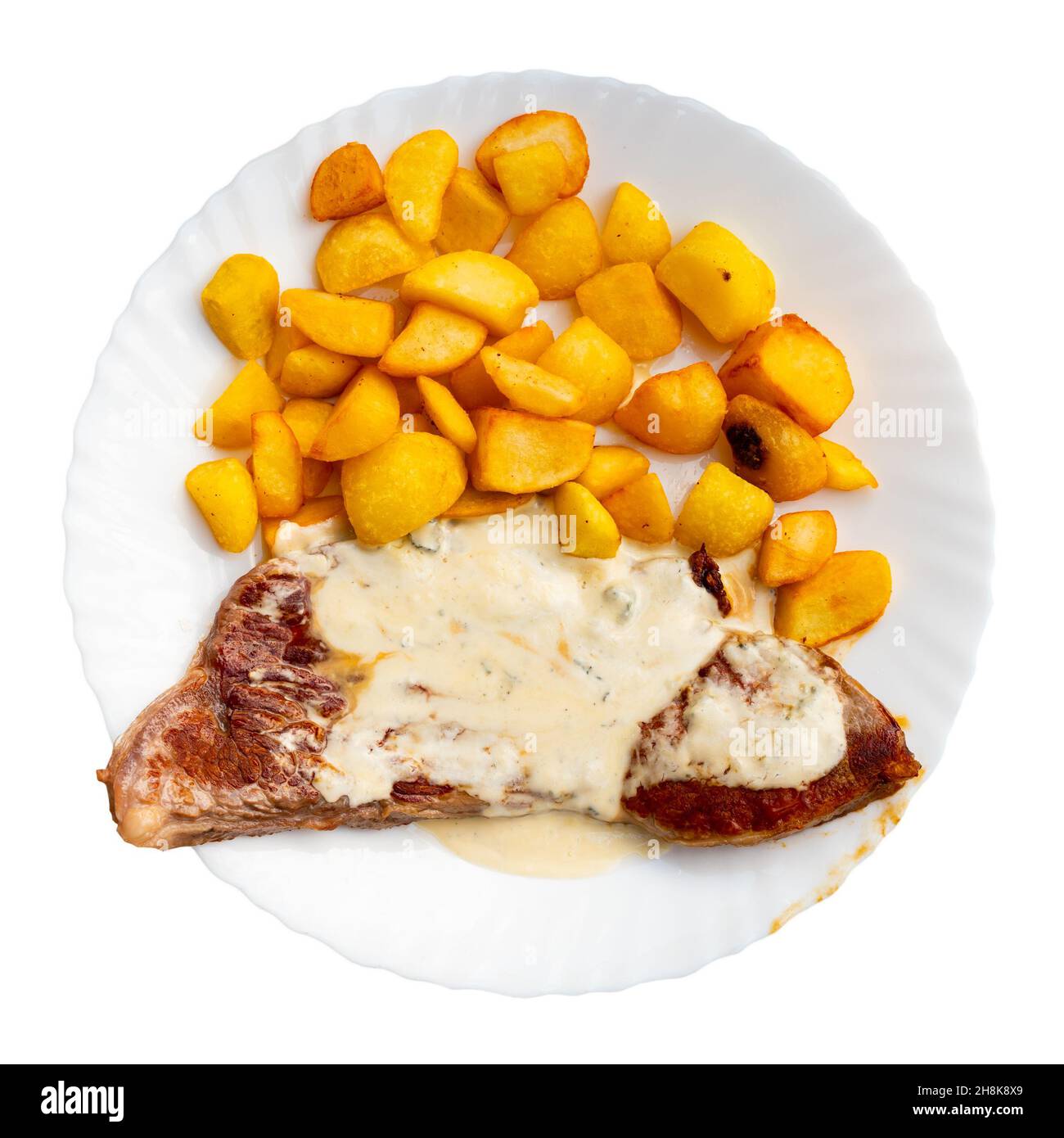 Portion Beefsteak mit blauer Käsesauce Stockfoto