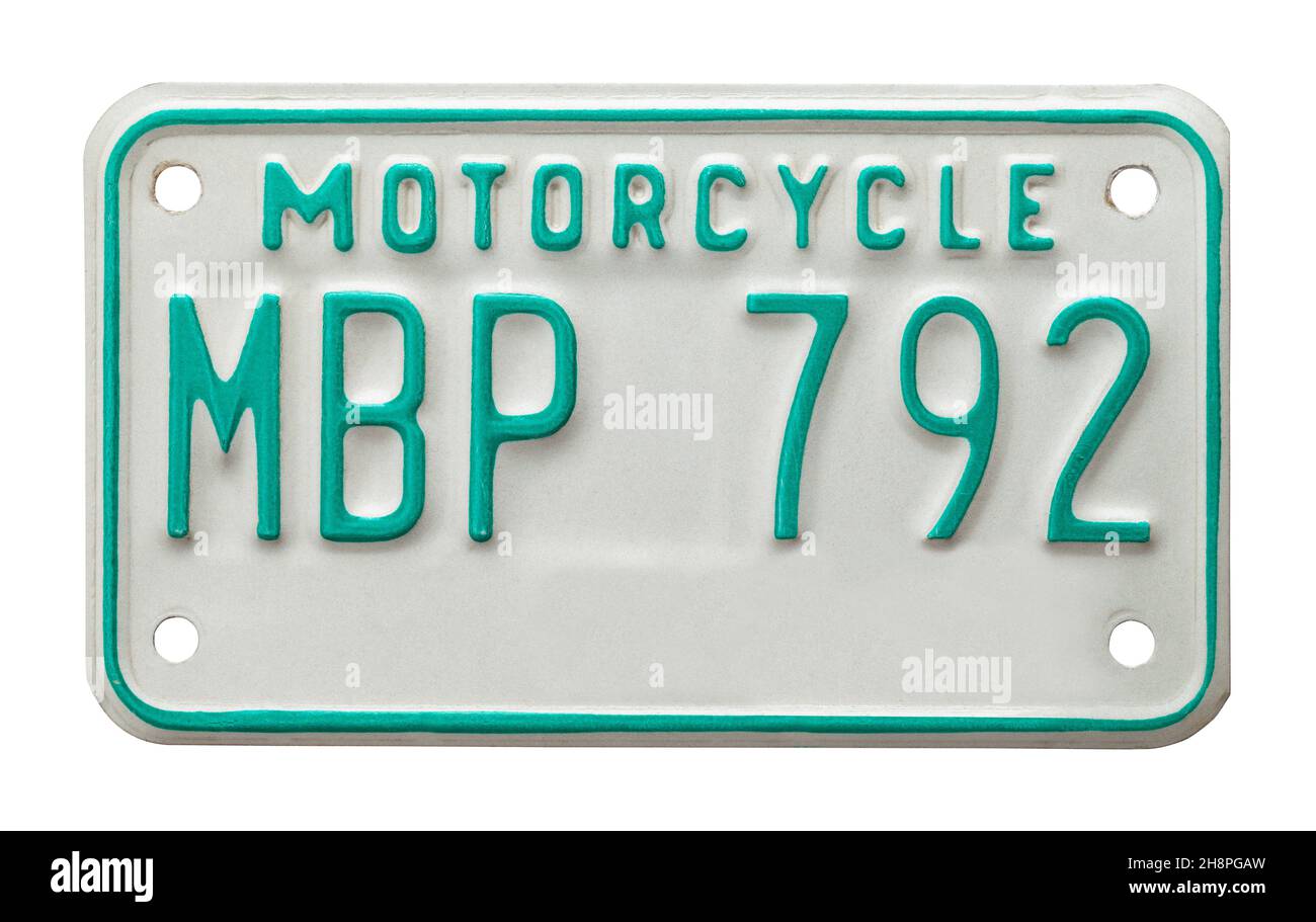 Grünes und weißes Motorrad-Kennzeichenschild aus Metall. Stockfoto