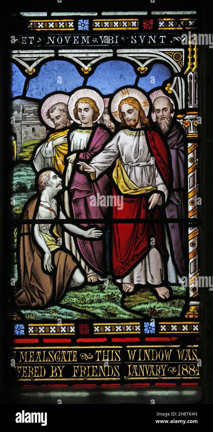 Ein Buntglasfenster von William Wailes, das Jesus heilt die Kranken und Lahmen, Allerheiligen Kirche, Boltongate, Cumbria Stockfoto