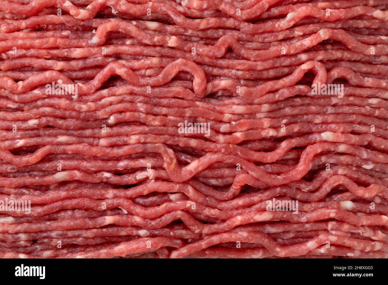 Frisches rohes, fettarmes Hackfleisch im Vollformat als Hintergrund Stockfoto
