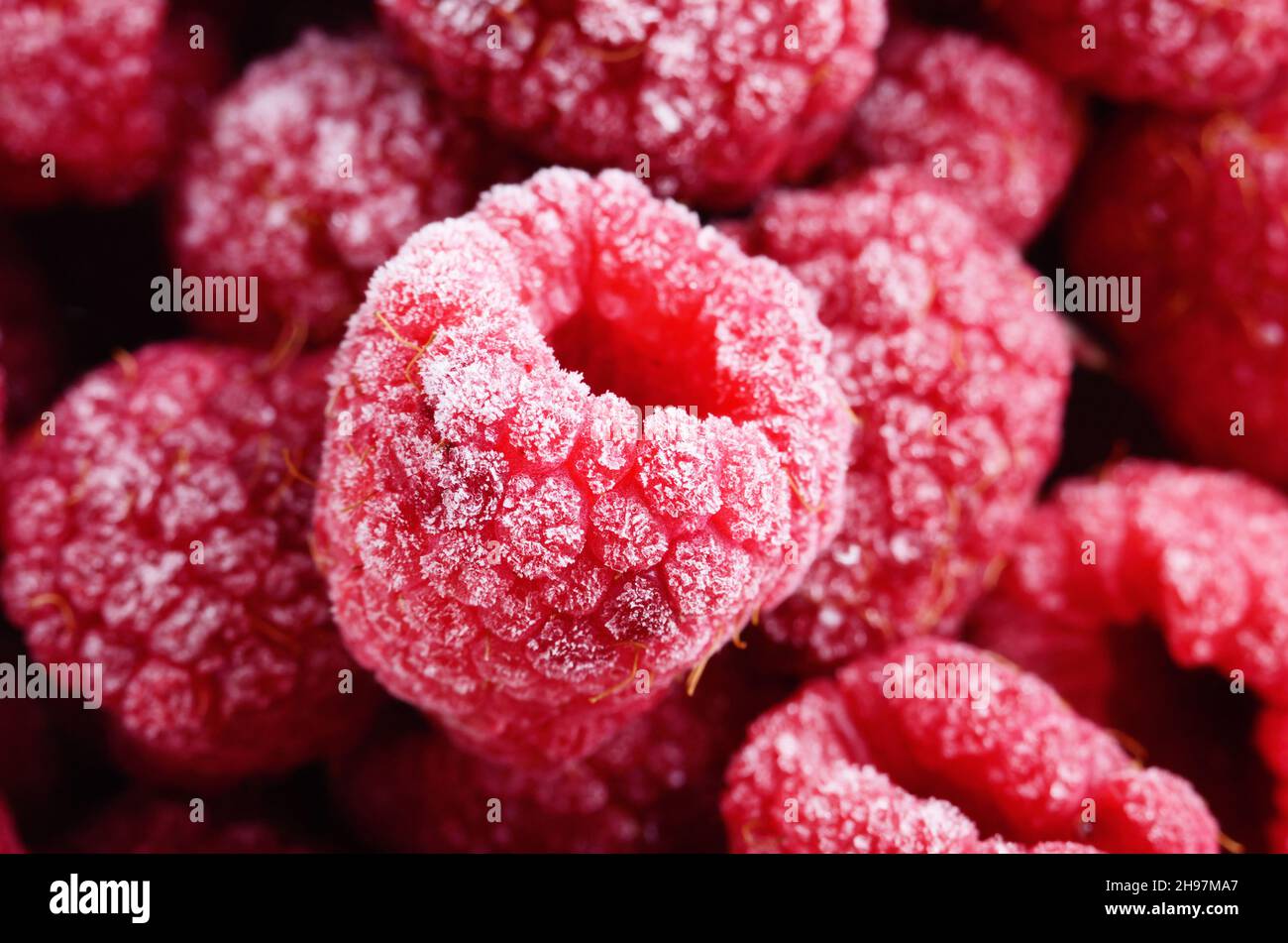 Closeup Hintergrundfoto rot gefrorene Himbeeren Stockfoto