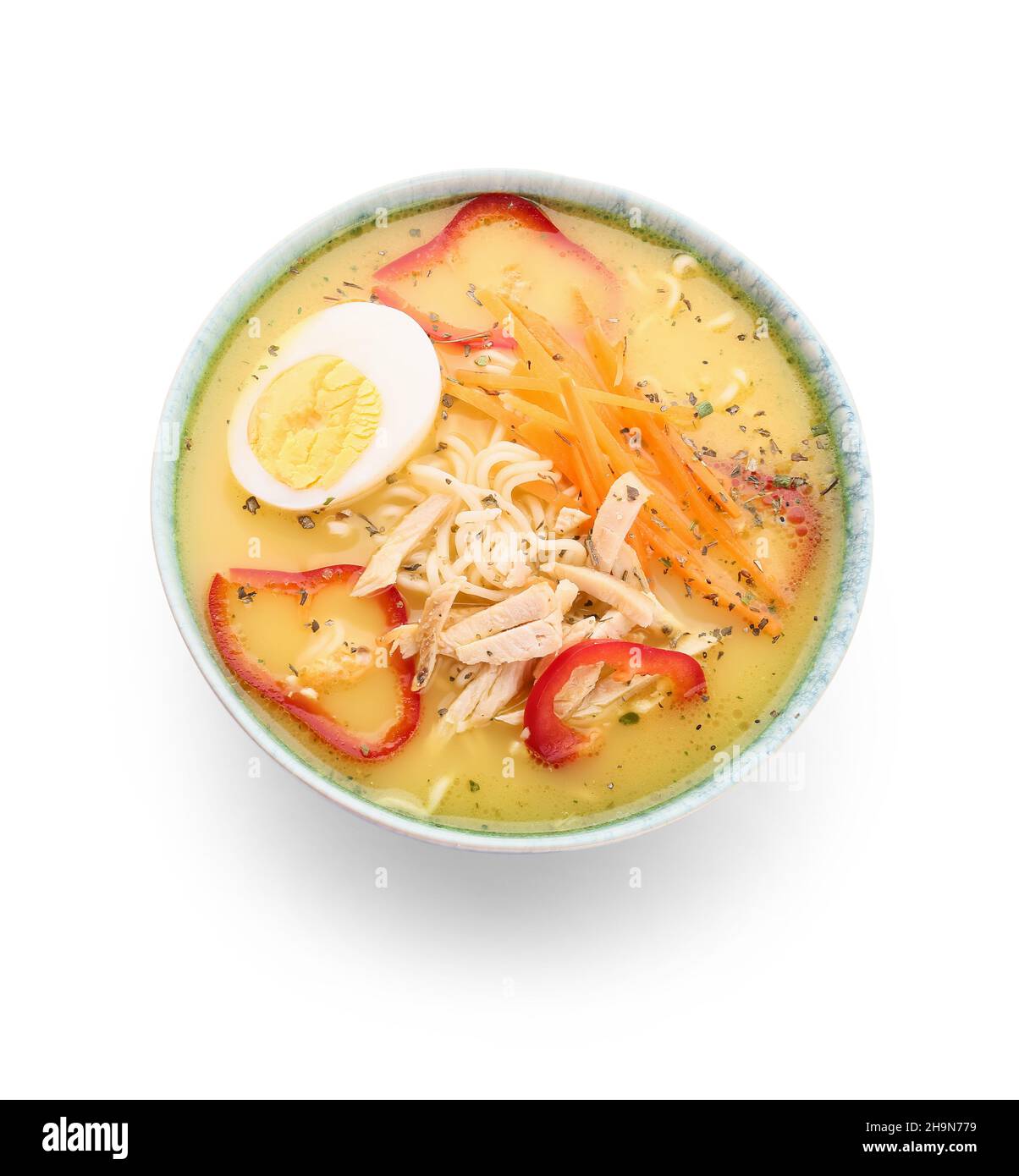Schüssel mit leckerer Thai-Suppe auf weißem Hintergrund Stockfoto