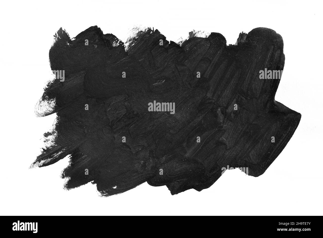 Schwarze Pinselstriche auf weißem Papier isoliert. Stockfoto