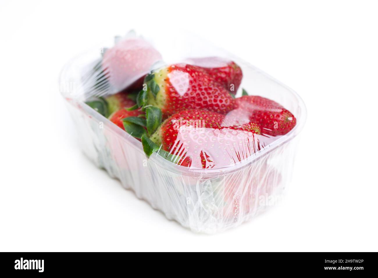 Erdbeeren, Folie, Kunststoff, künstlich, Lebensmittel, Obst, weiß, Hintergrund, Massenproduktion, oben, Luftaufnahme, packend, verpackt, perspektivisch, Erdbeere Stockfoto