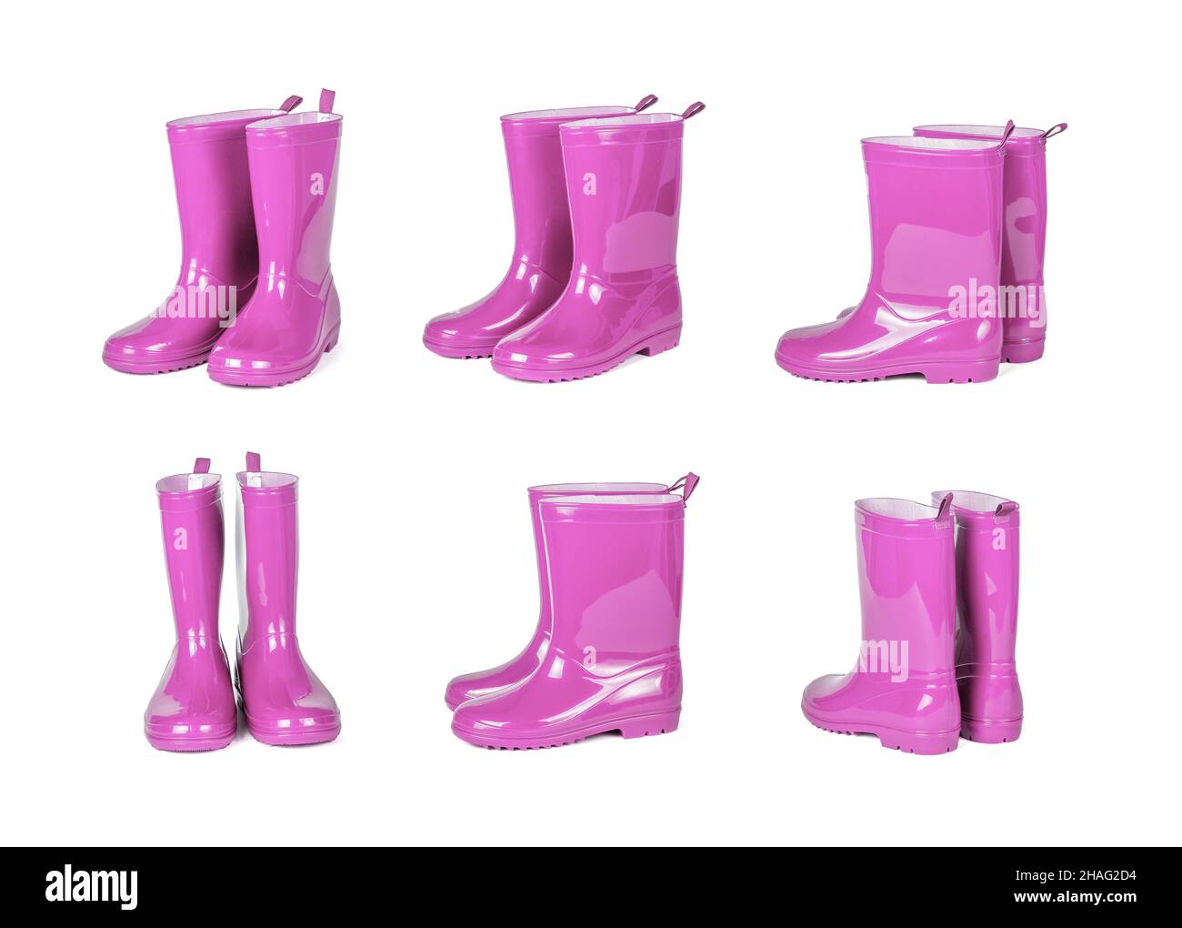 Set von rosa Gummistiefel isoliert auf weißem Hintergrund. Stockfoto