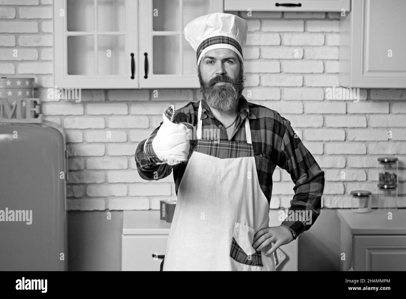 Professioneller Koch Mann zeigt Zeichen für lecker. Stockfoto