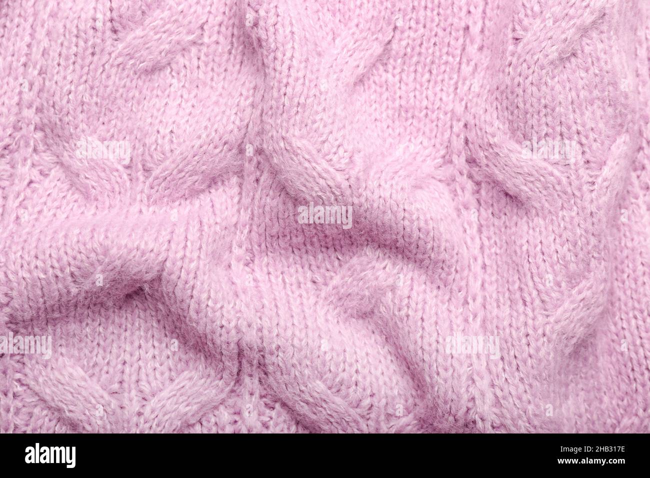 Struktur aus zerknittertem Strickmaterial mit stilvollem Muster als Hintergrund Stockfoto