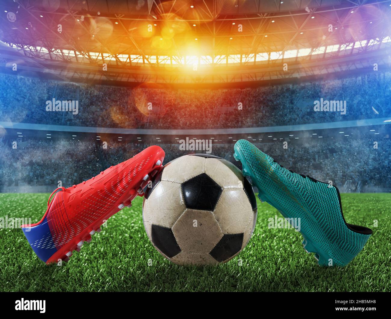 Fußballschuhe auf dem Spielplatz eines großen Stadions Stockfoto