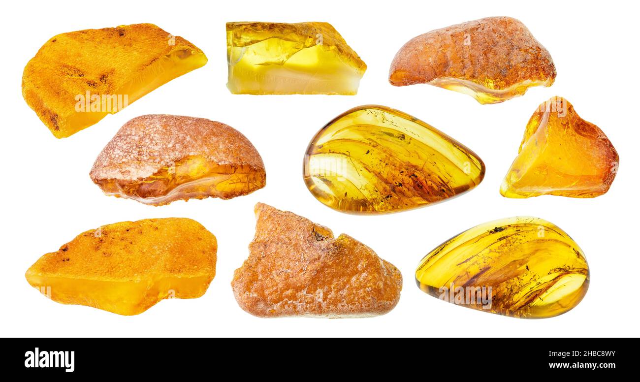 Set aus verschiedenen bernsteinfarbenen Edelsteinen auf weißem Hintergrund Stockfoto