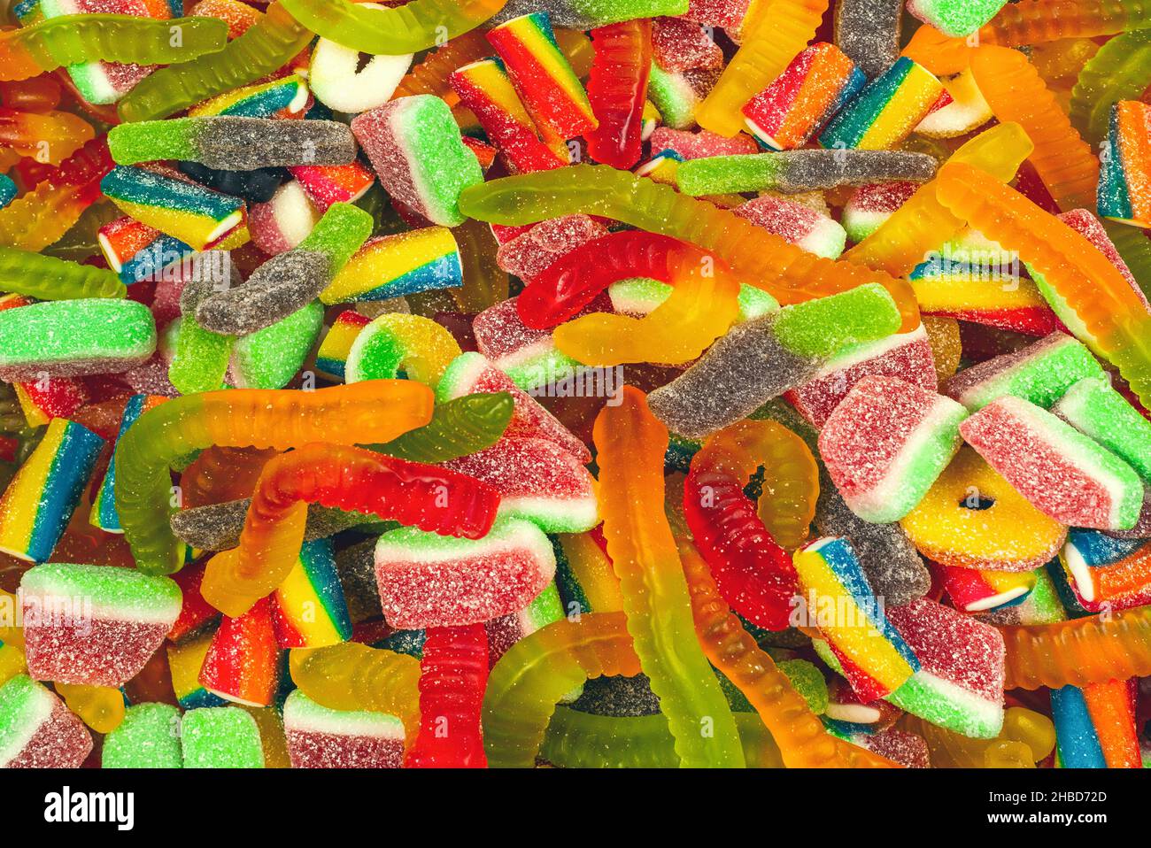 Verschiedene leckere leckere leckere leckere Süßigkeiten. Draufsicht. Gelee Süßigkeiten Hintergrund. Stockfoto