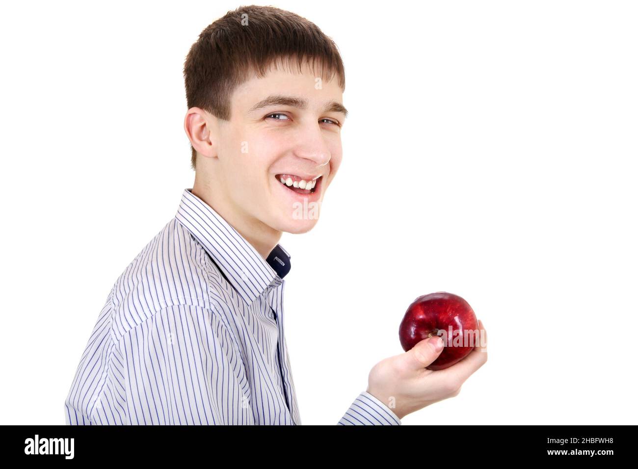 Schöner Teenager mit einem Apfel isoliert auf dem weißen Hintergrund Stockfoto