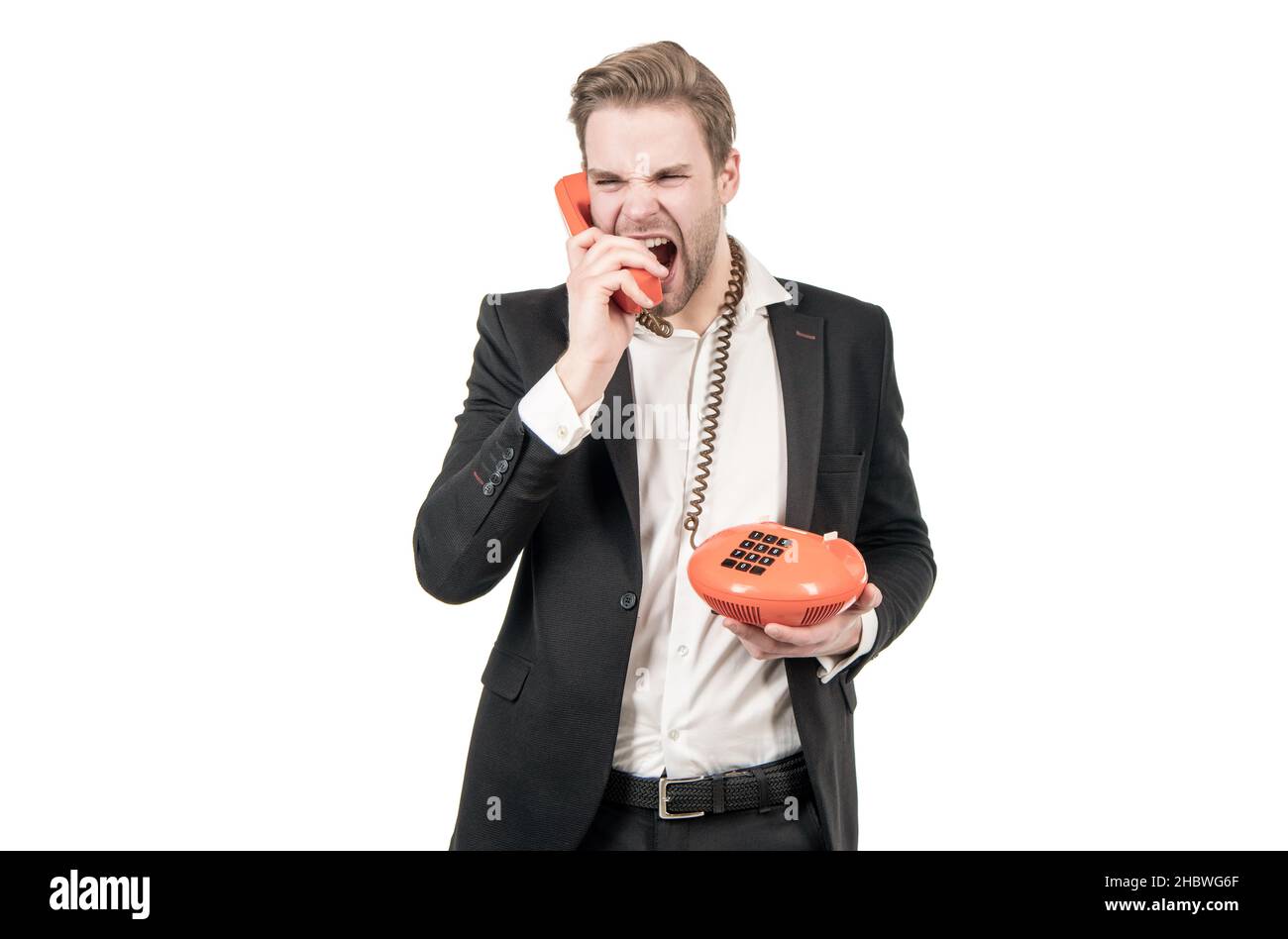 Wütender Geschäftsmann schreit im Vintage-Telefonhörer, der Festnetztelefon, Telefonie hält Stockfoto