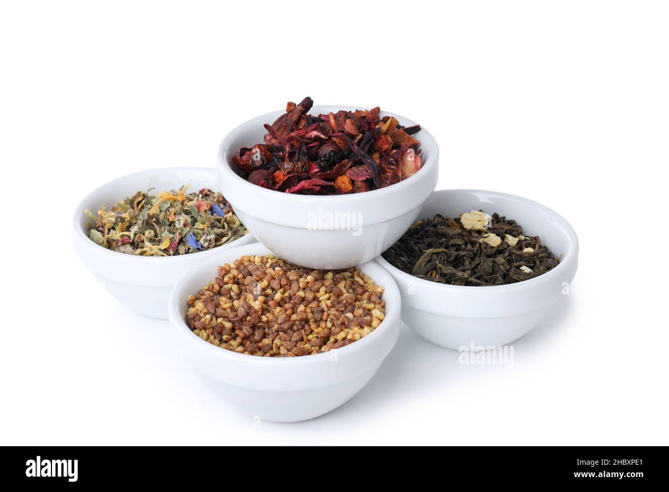 Konzept des Kochens von Tee mit verschiedenen Teesorten isoliert auf weißem Hintergrund Stockfoto