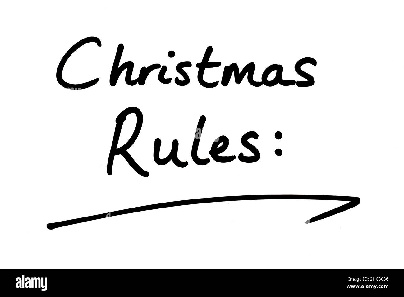 Überschrift Weihnachtsregeln, handgeschrieben auf weißem Hintergrund. Stockfoto