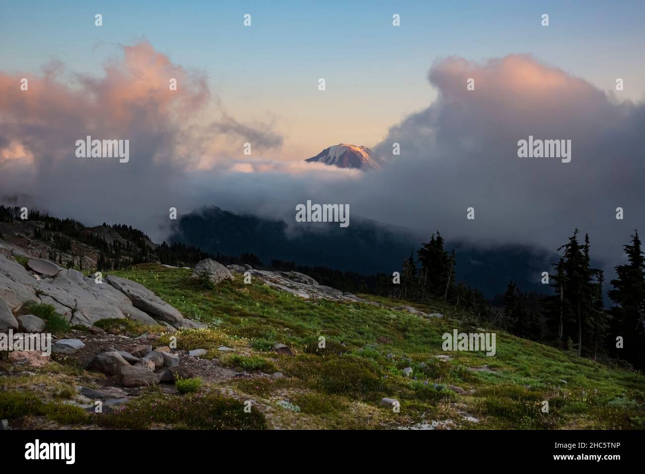 WA19919-00...WASHINGTON - Breaking Clouds over Mount Adams at Sunset near Snowgrass Flats in the Goat Rocks Wilderness. Stockfoto
