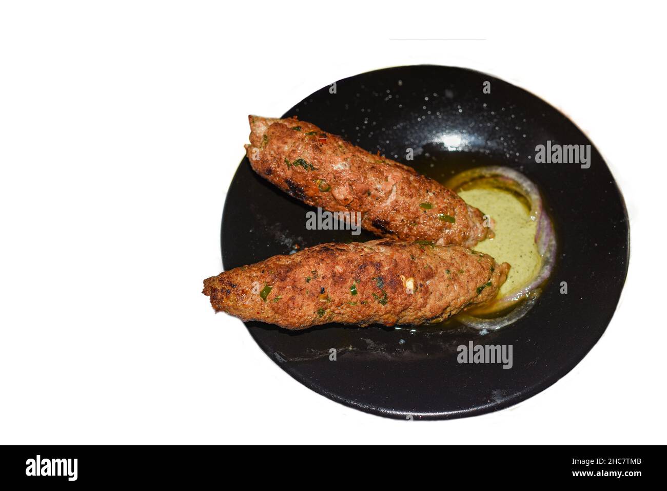 Der berühmte Qureshi Kebab in Delhi zusammen mit Minzchutney. Stockfoto