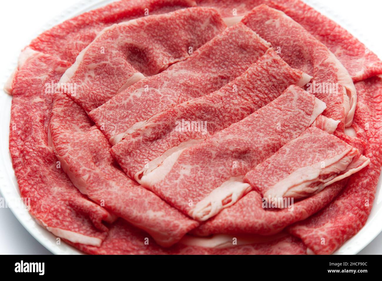 Rohes Rindfleisch japanisches schwarzes Wagyu-Fleisch isoliert auf weißem Hintergrund Stockfoto