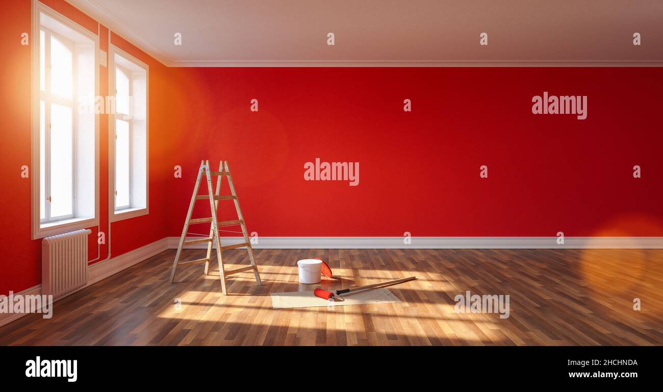 Zimmer nach der Renovierung mit Leiter und Lackeimer. Leere rote Wand, Bannergröße, mit Copyspace für Ihren individuellen Text. Stockfoto
