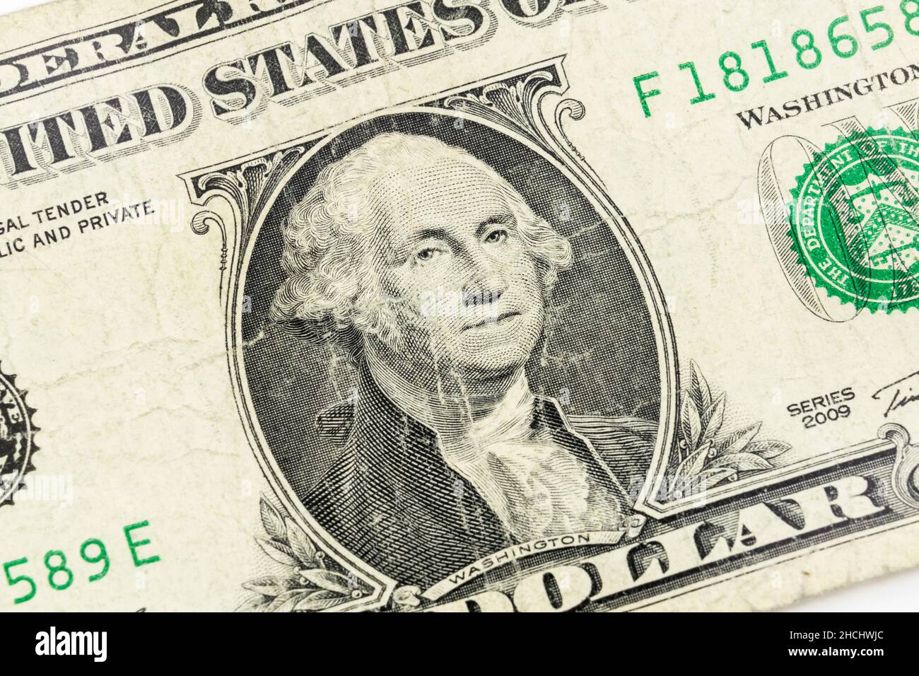 Nahaufnahme von George Washington auf einem alten, abgenutzten US-Dollar-Schein. Stockfoto