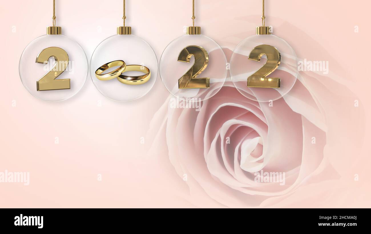 goldene Eheringe transparent Drop Schatten Glas Kugel 2022 Ziffern und schönen rosa Hintergrund Stockfoto