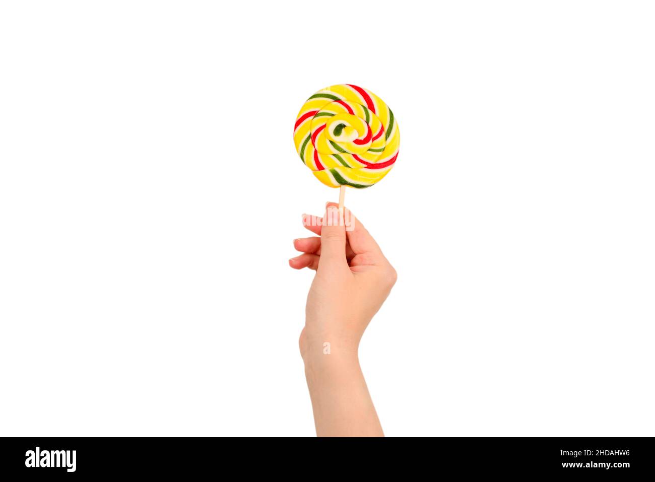 Lollipop in weiblicher Hand isoliert auf weißem Hintergrund. Platz für Text oder Design. Stockfoto