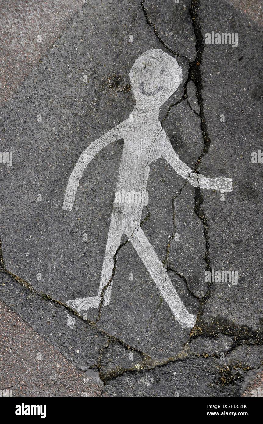 Eine wandelnde Strichfigur auf der Straße Stockfoto