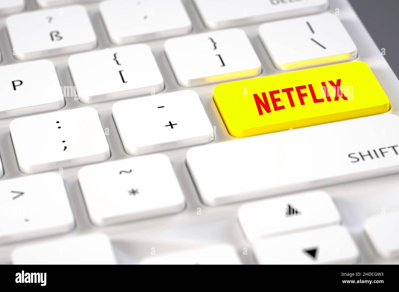 Weisse Computertastatur, belagerter Sondergeschmack, Aufschrift, Netflix; Streamingdienst, Stockfoto