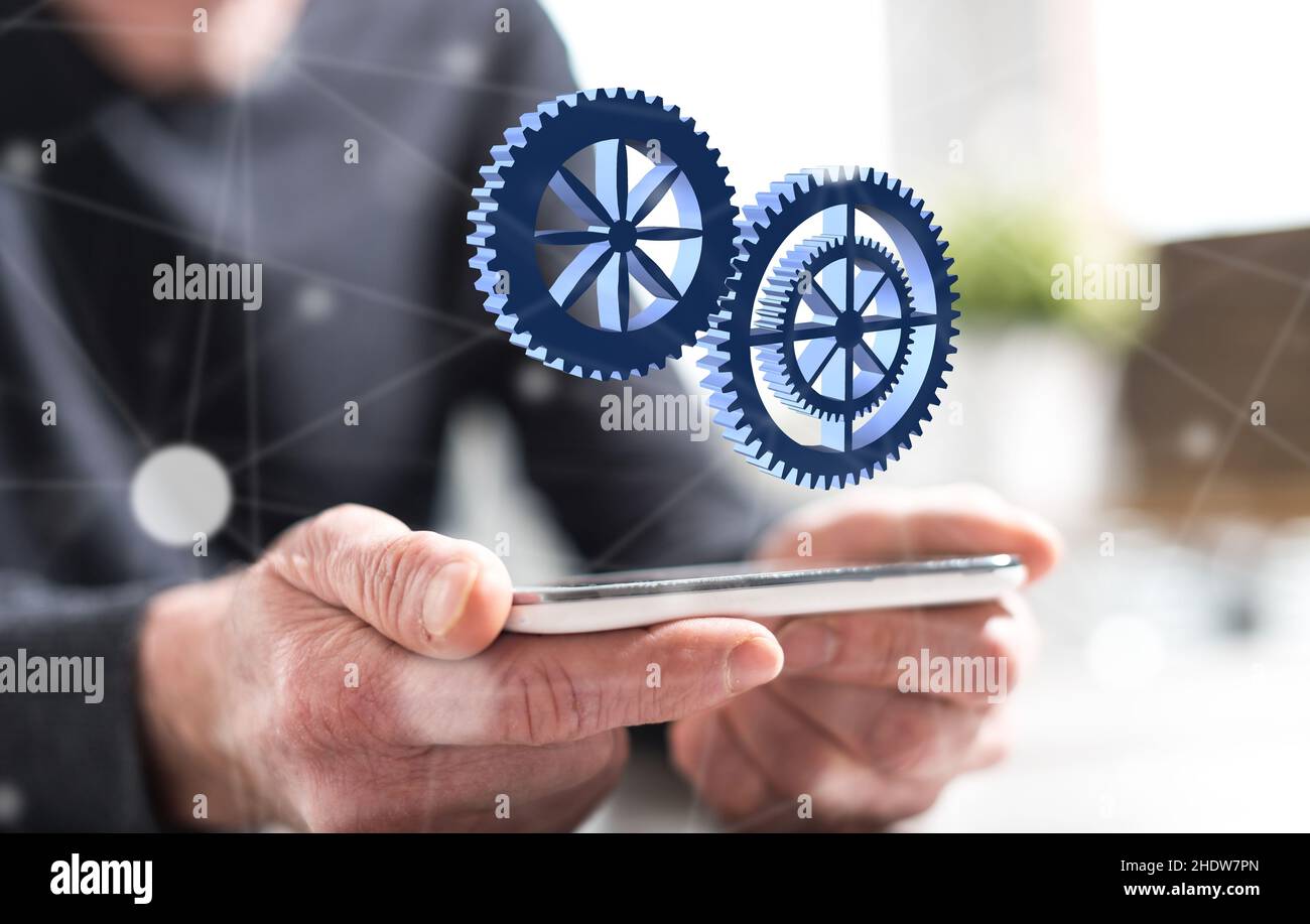 Hände des Mannes hält ein Smartphone mit Teamwork-Konzept Stockfoto