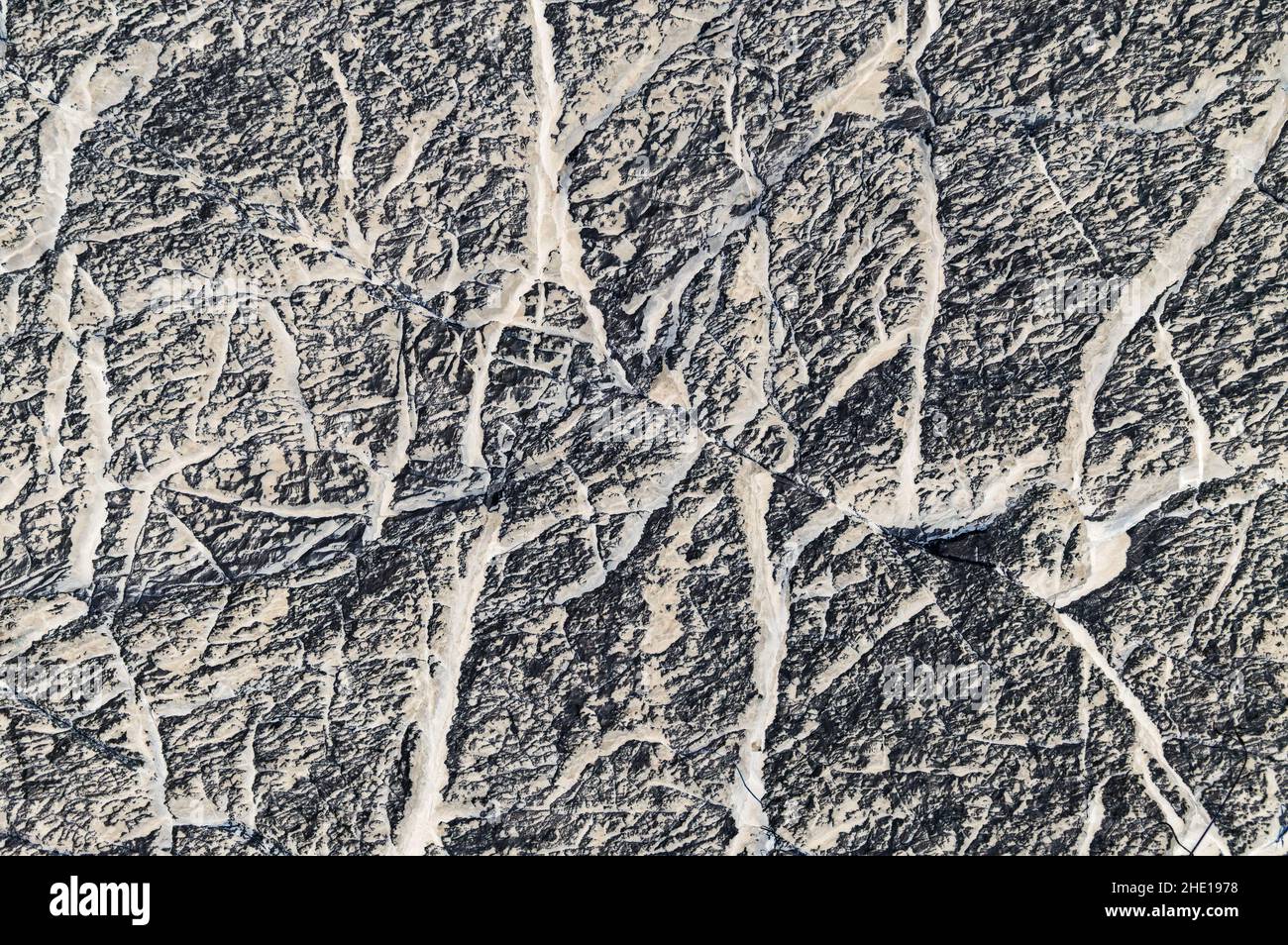 Graue Grunge gemusterte Hintergrundstruktur auf der Basis von Kalkstein-Oberfläche Stockfoto