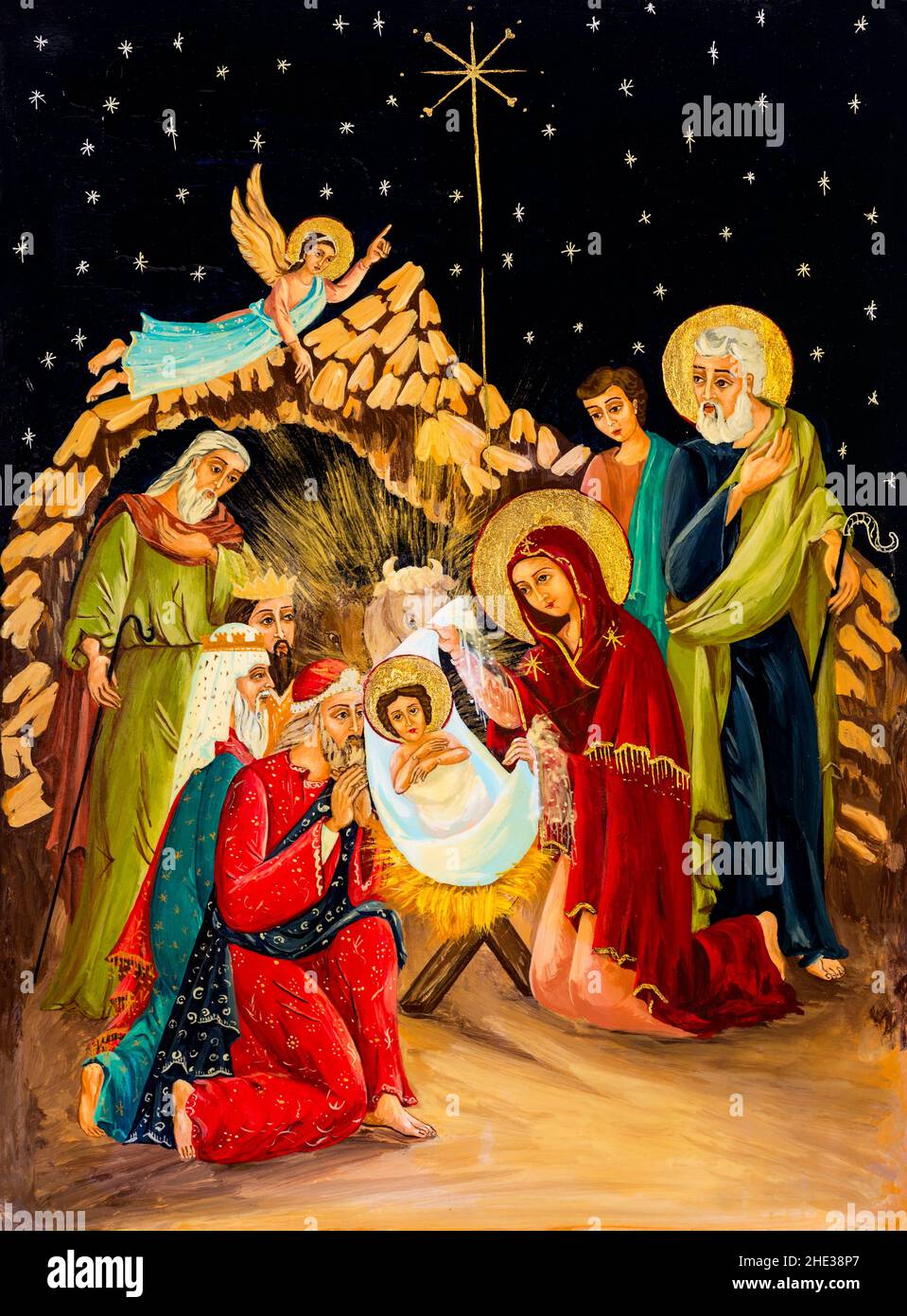 Naive Malerei, die die Geburt Jesu Christi auf Holztäfelchen darstellt. Weihnachtsgemälde mit Weihnachtskrippe. Stockfoto