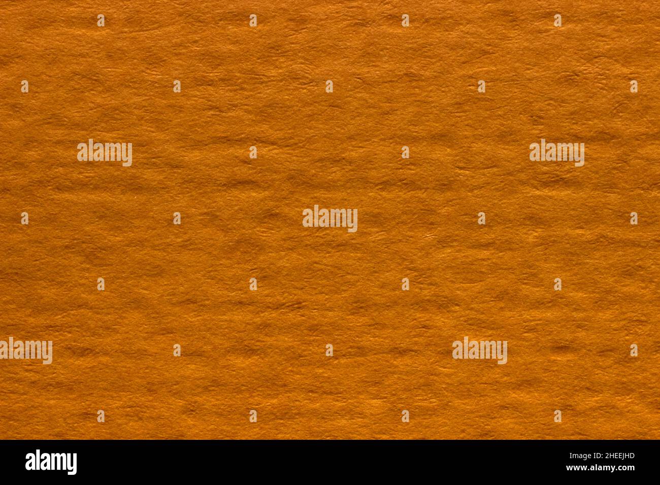 Orangene strukturierte Hintergrund Nahaufnahme mit Punktmuster. Hintergrund für das Design Stockfoto