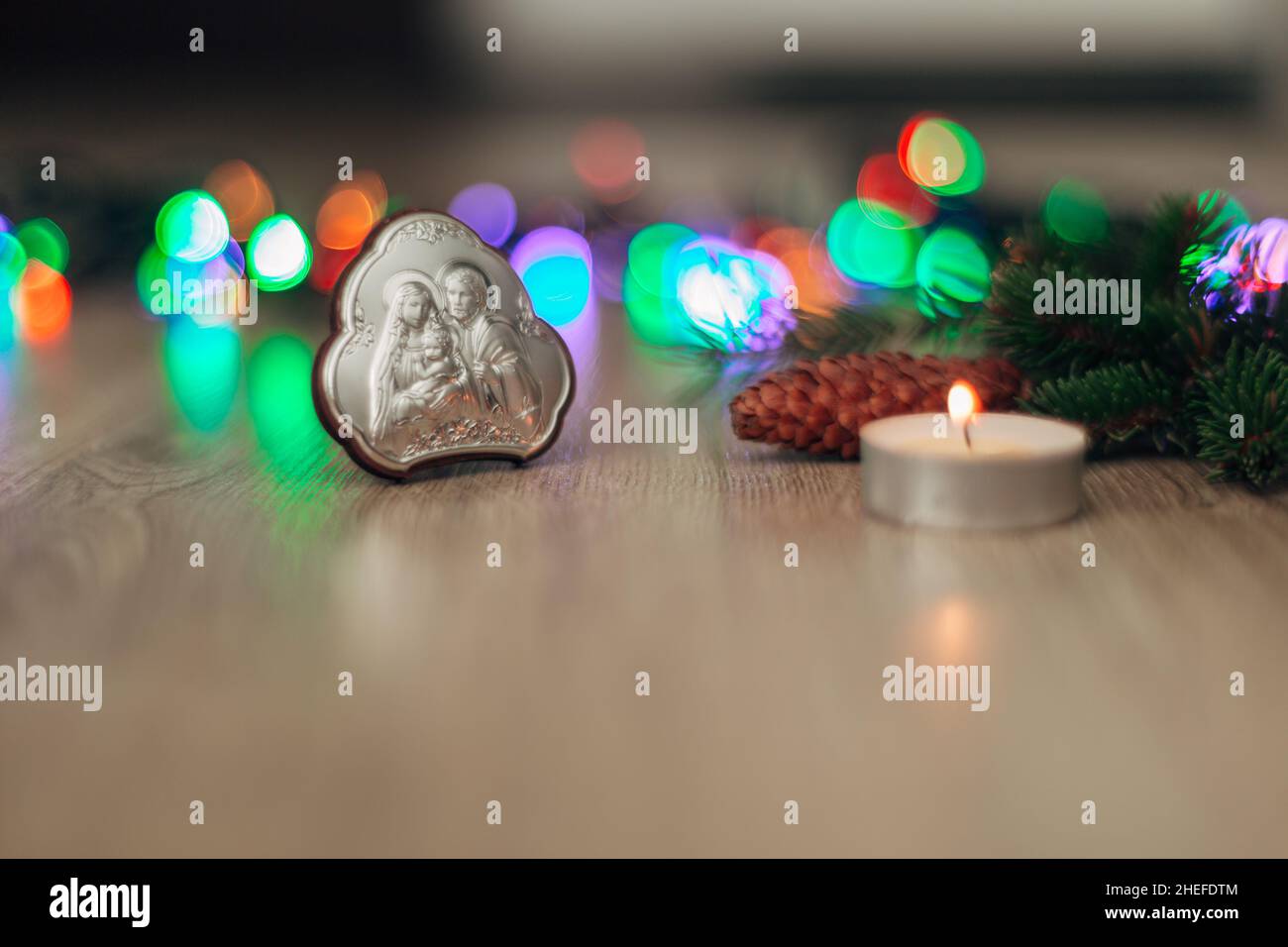 Christmas Composition of Church Icon on a Wooden Background With Multicolored Boken Stockfoto