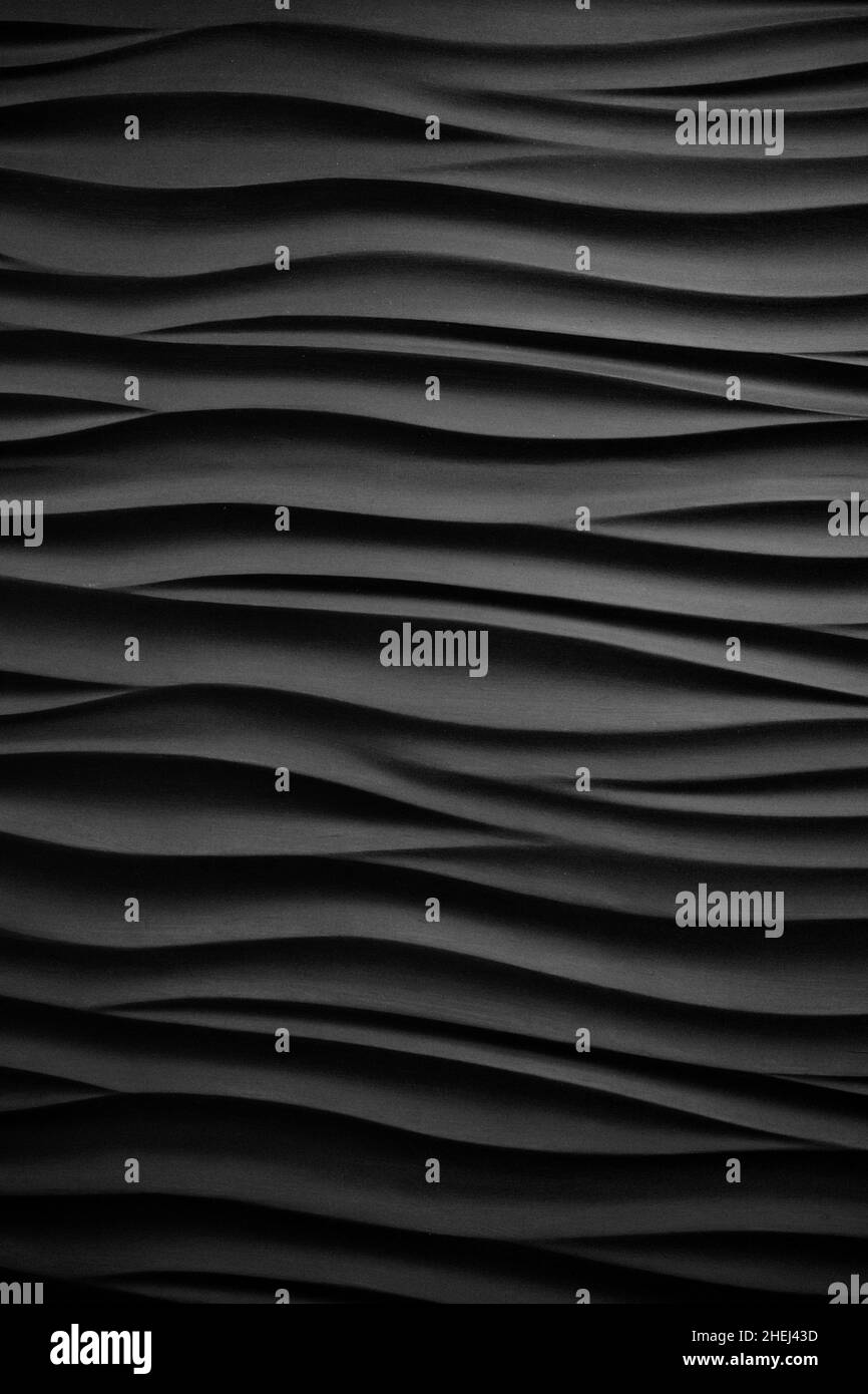 Dunkle, grungige Oberfläche, abstrakte, wellenschwarze Textur Stockfoto