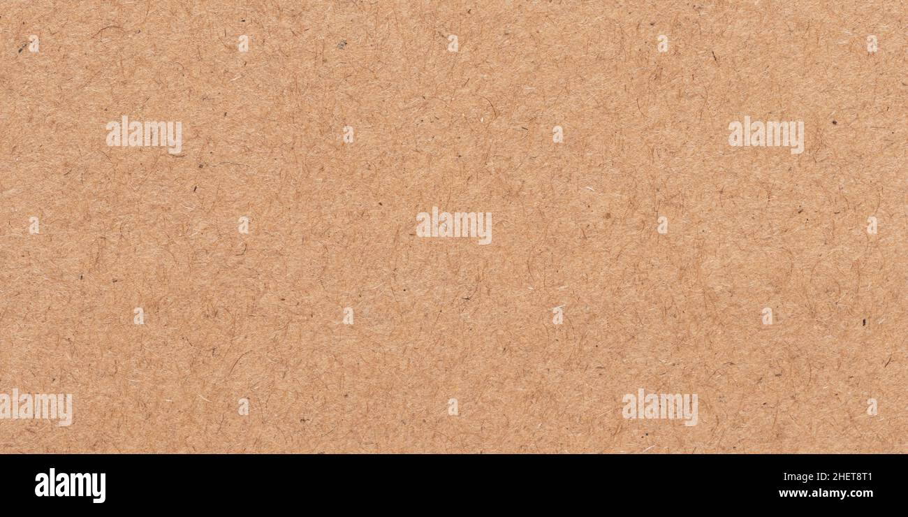Hellbraune Textur. Kartonverpackung. Beiges Pergament, Manuskript. Rauer Hintergrund. Natürliche Oberfläche eines Blattes alten Papiers Stockfoto