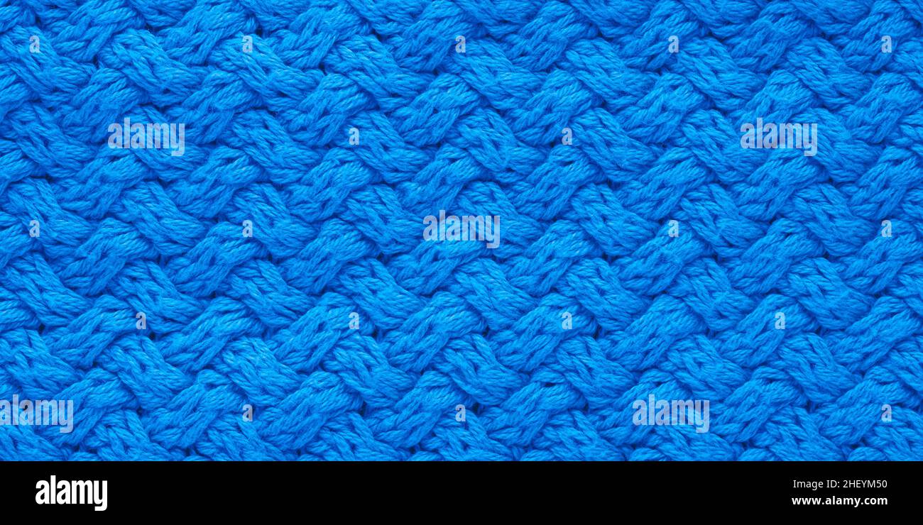 Dunkelblaue Strickstruktur. Abstrakter Hintergrund, Muster. Detail eines warmen Winterpullovers Stockfoto