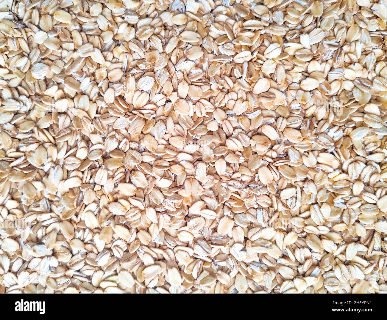 Haferflocken Hintergrund. Gesunde Ernährung. Flocken zum Frühstück. Vollkorn Hafer Hintergrund. Stockfoto