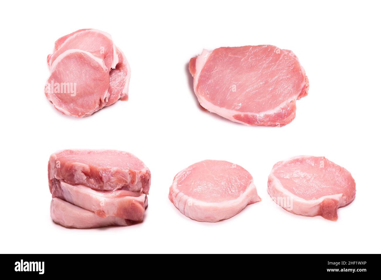 Rohe Schweinefleischstücke isoliert auf weißem Hintergrund. Draufsicht. Stockfoto