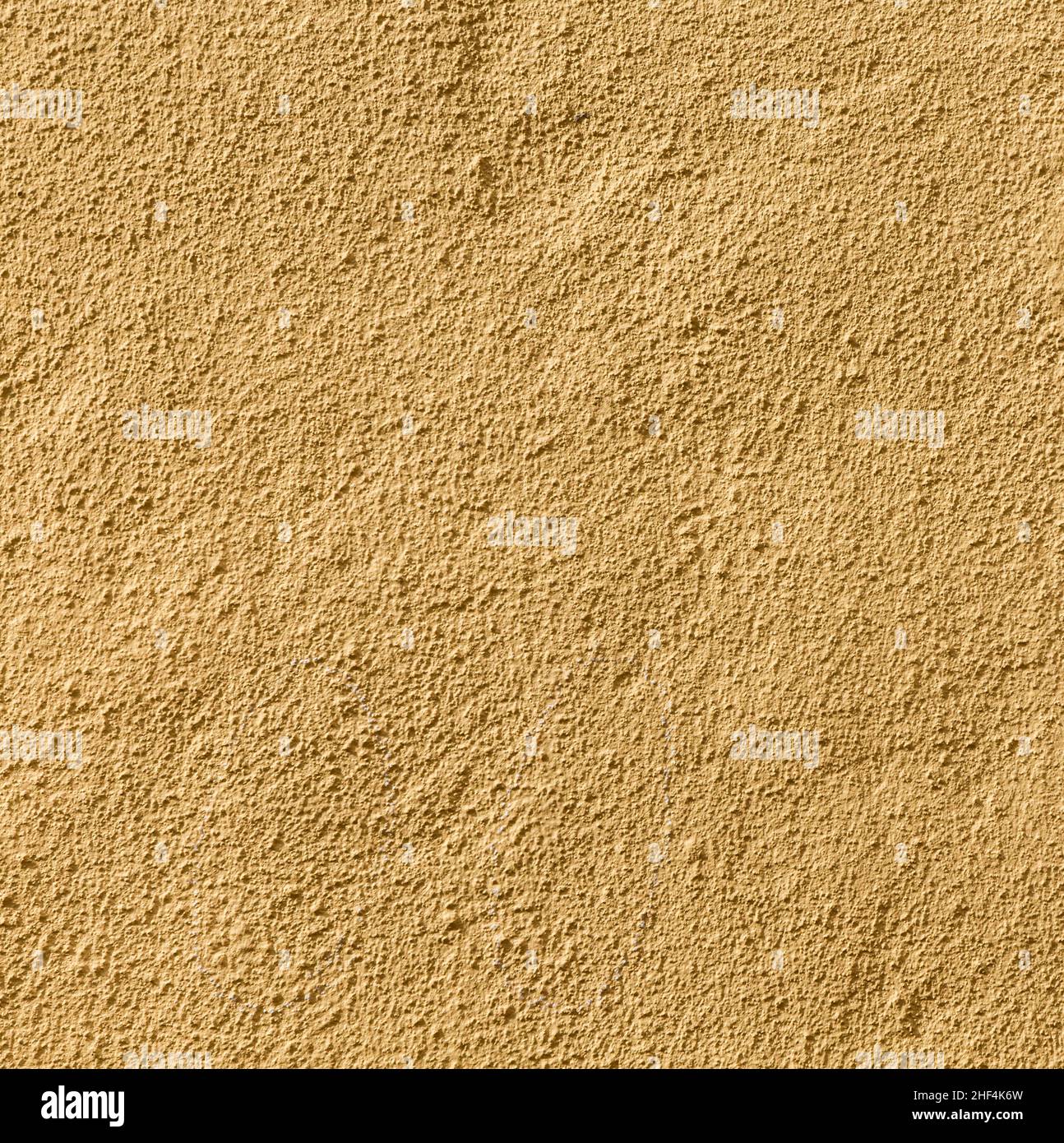 Ockerfarbener Wandhintergrund gibt ein harmonisches Muster Stockfoto